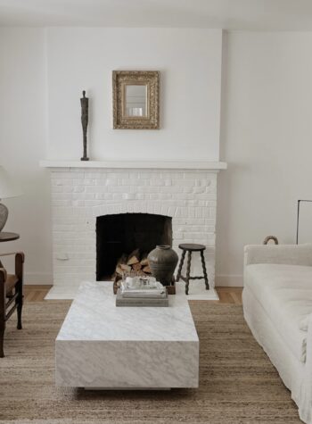 safari chairs, slipcover ikea farlov, marble restoration hardware coffee table, josh young design house, shell sconces