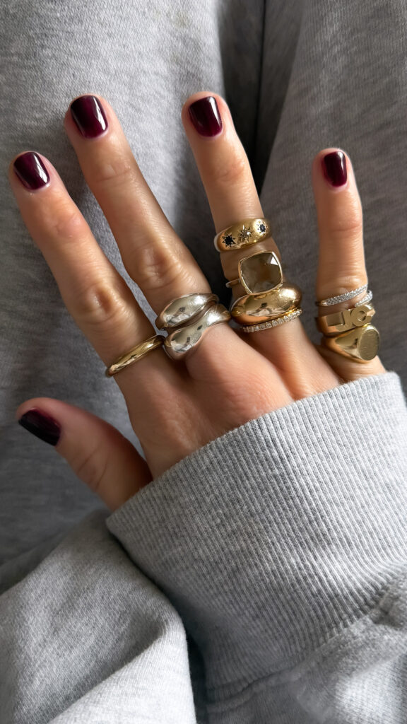 gold and silver ring stacks on hand.
